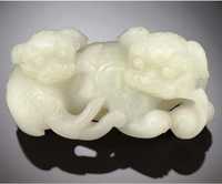 19th/20th Century A white jade carving of two Buddhistic lions